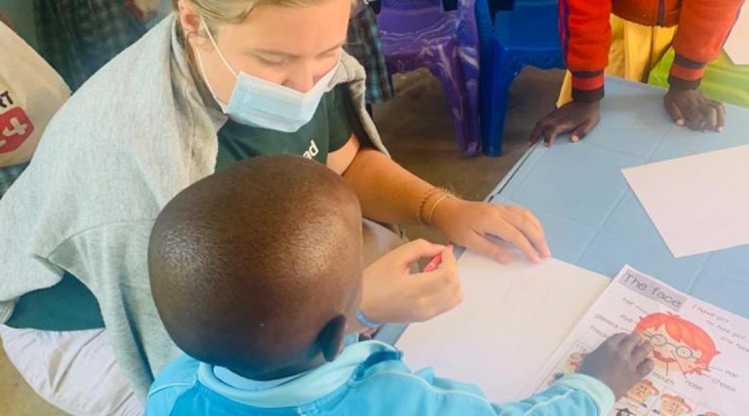 A Projects Abroad volunteer teaches young students at a Tanzanian school.